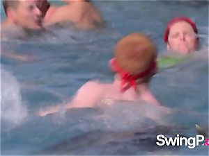 crazy redheads play with different stripped to the waist dolls by the pool