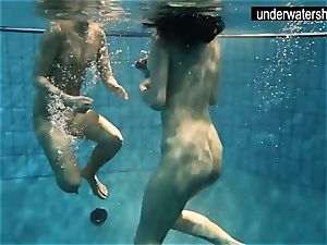 two fantastic amateurs showing their bodies off under water